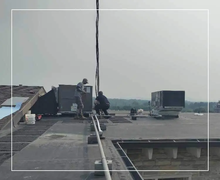 A man standing on top of a building.